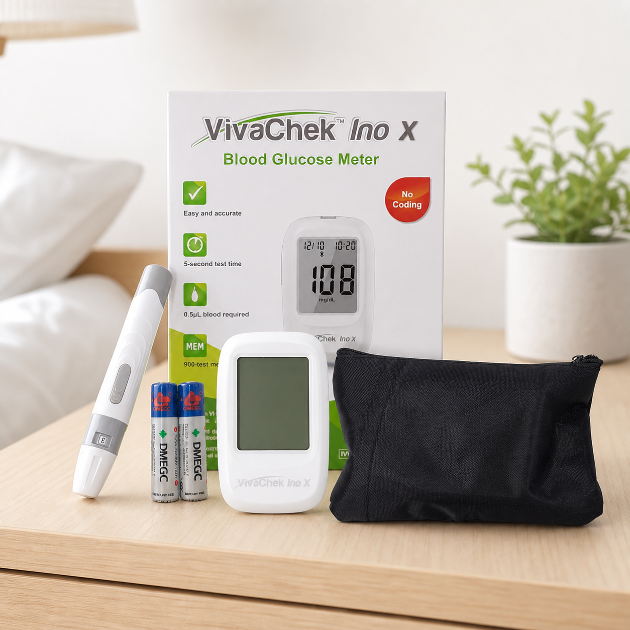 Glucómetro VivaChek Ino X con accesorios en mesa de hogar
